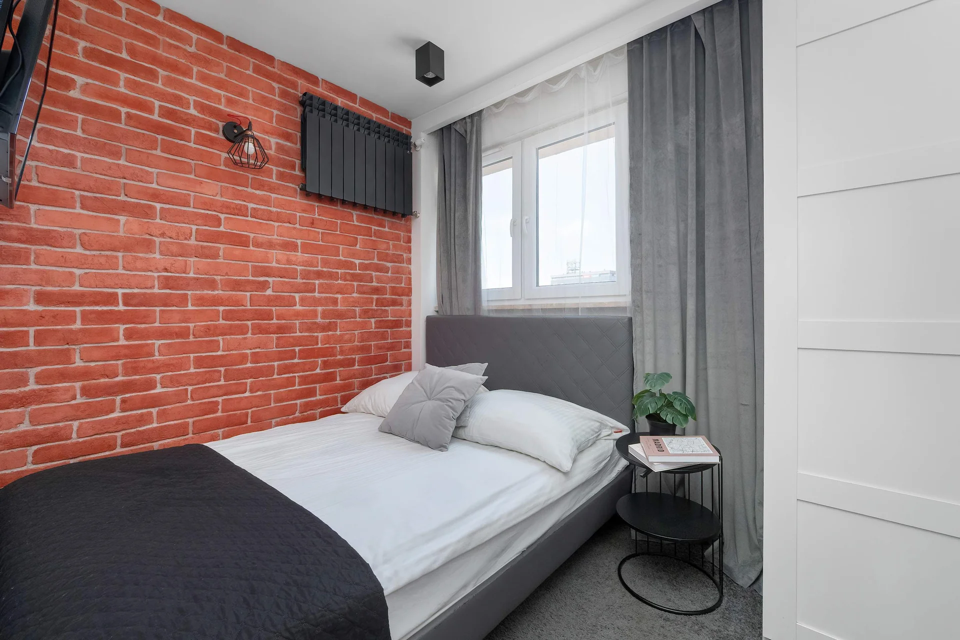 The bedroom's modern design ensures a comfortable stay.
