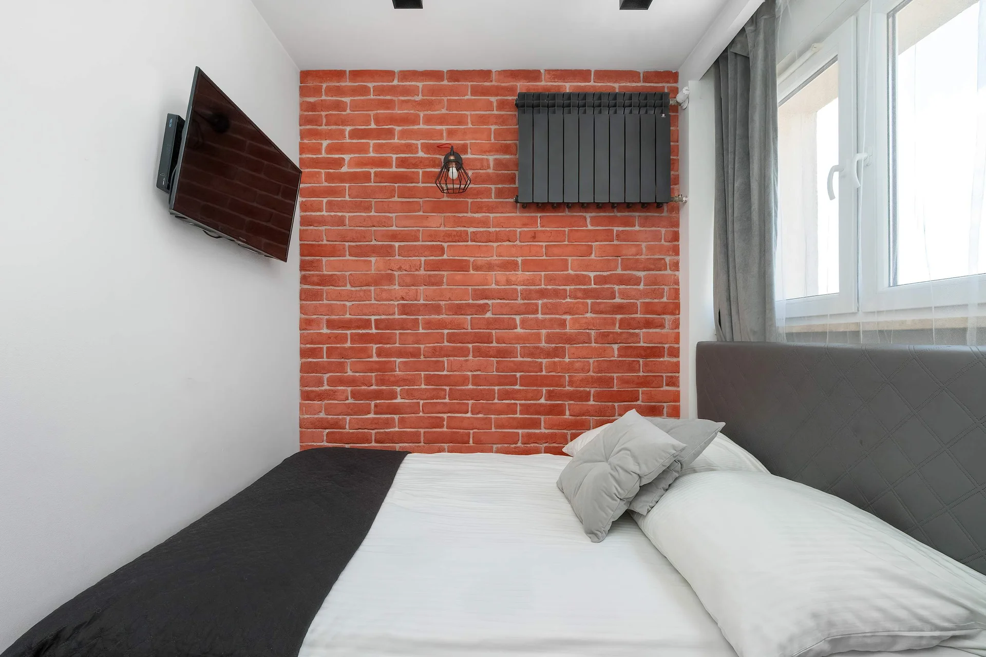 The bedroom's elegant decor creates a serene and restful environment.