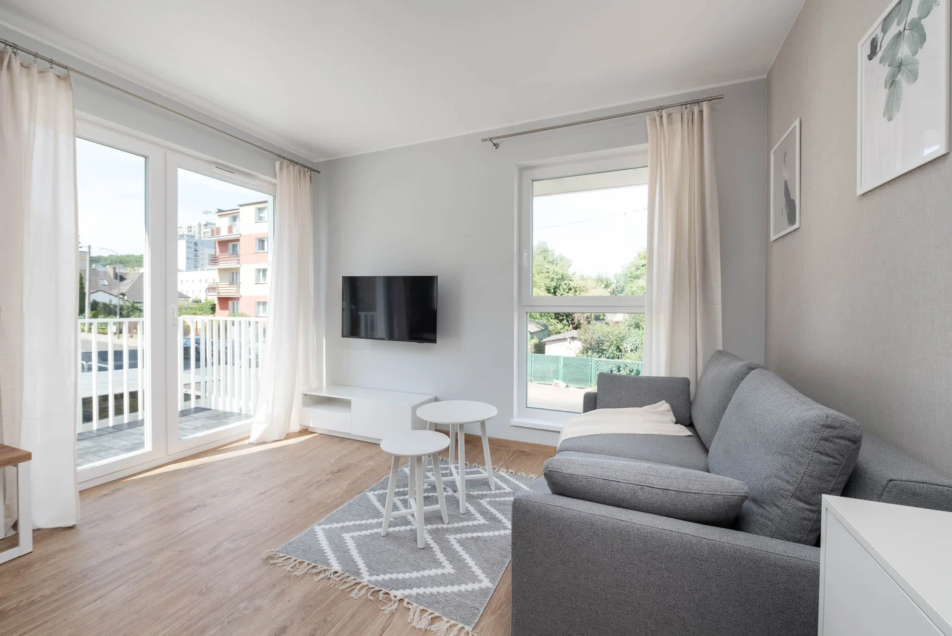 The elegant living area featuring a double sofa bed, perfect for relaxing or sleeping.