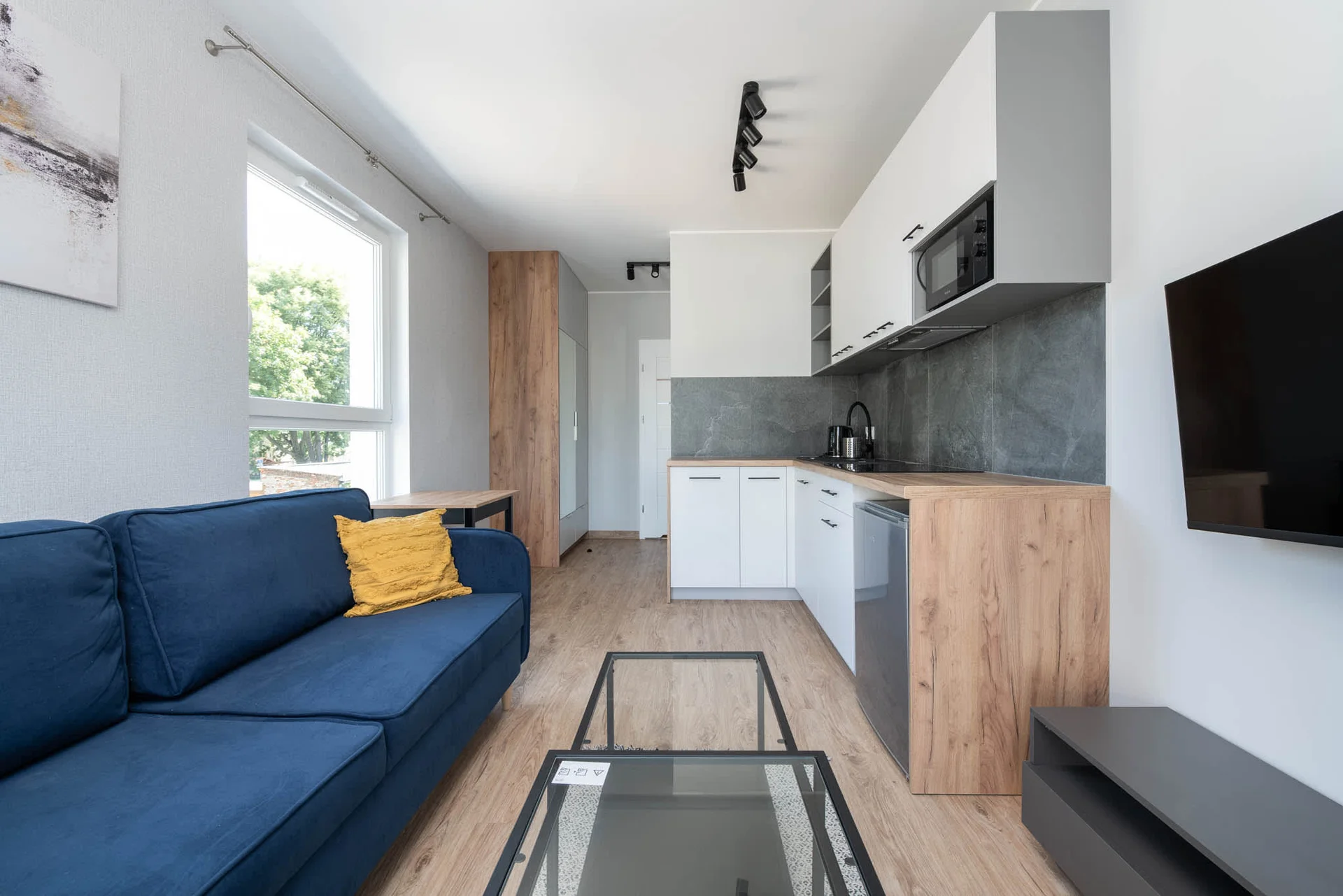 The living area's modern and stylish decor creates a welcoming atmosphere.