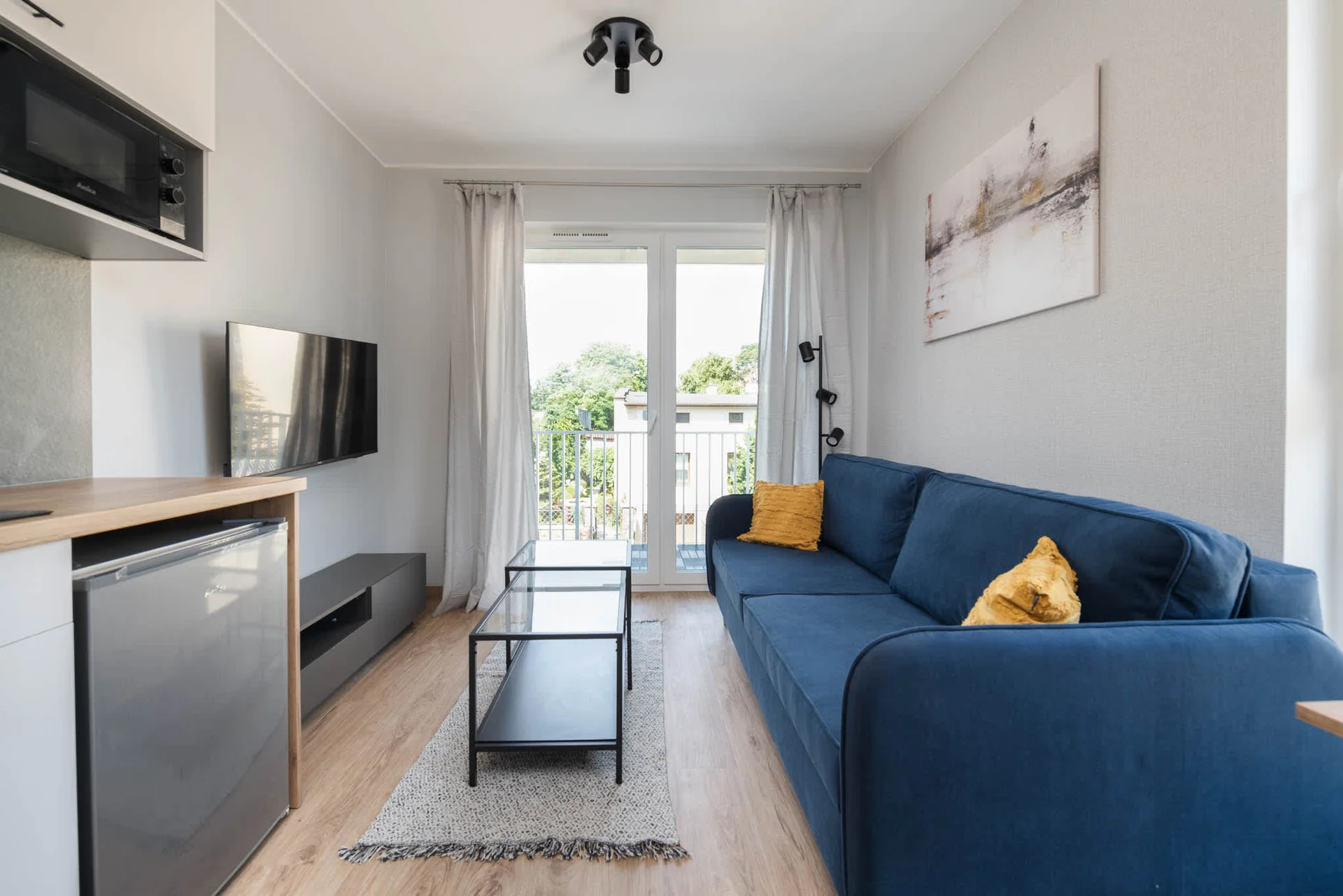 Enjoy your favorite shows on the flat-screen television in the elegant living area.
