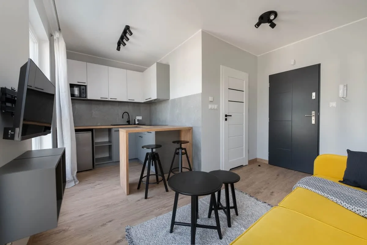 The living area's modern and stylish decor creates a welcoming atmosphere.
