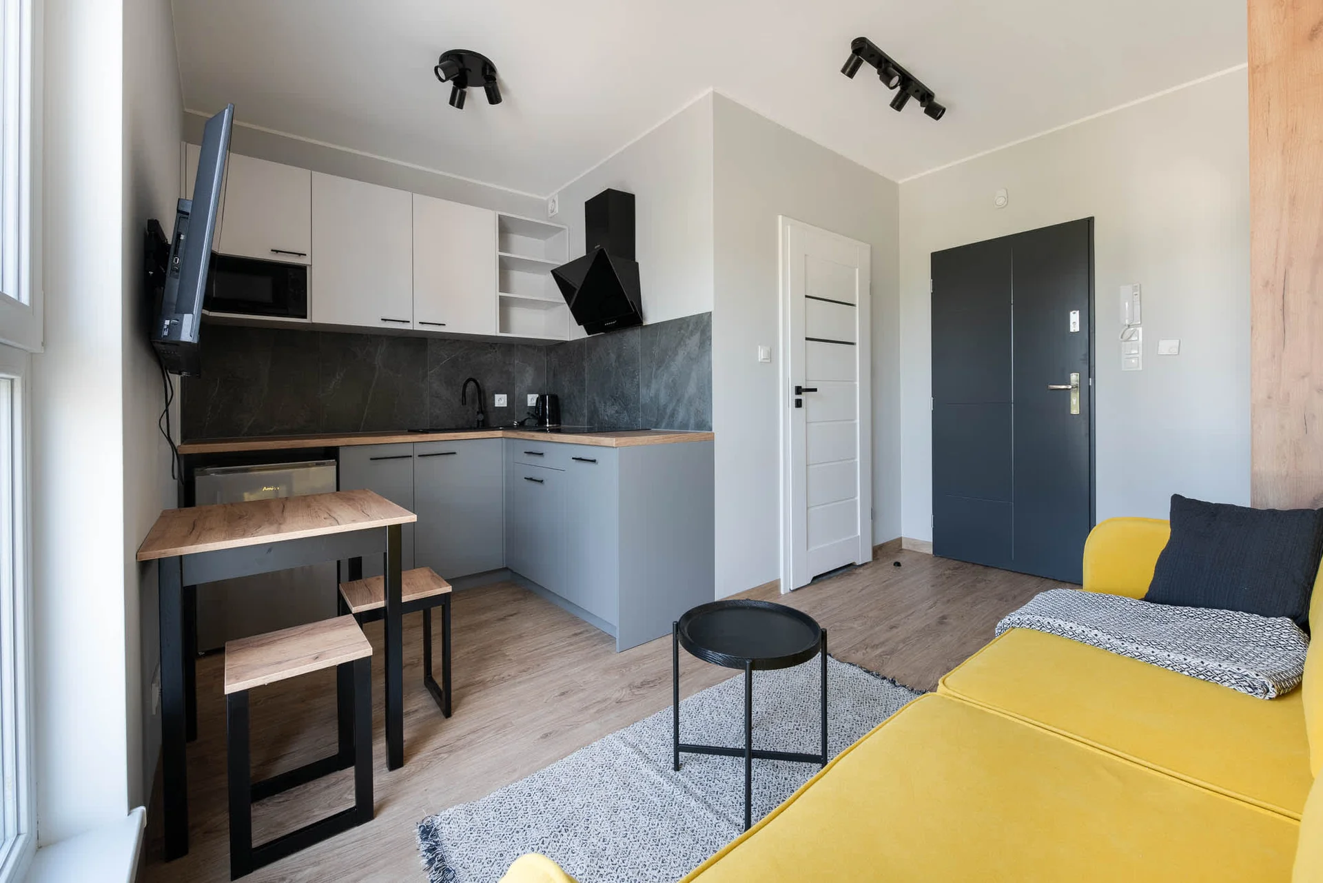 The living area's modern and stylish decor creates a welcoming atmosphere.