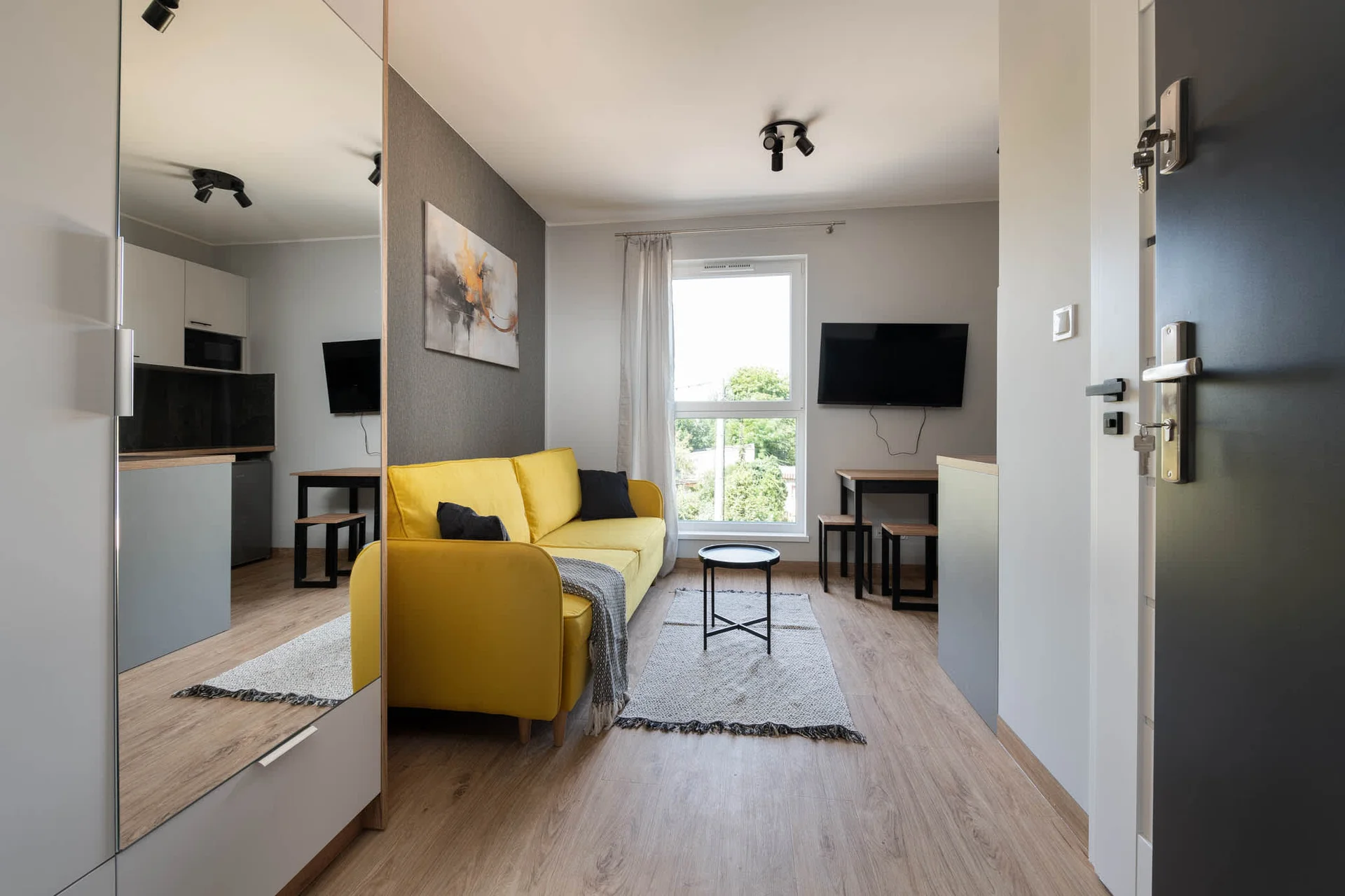 The elegant living area featuring a double sofa bed, perfect for relaxing or sleeping.