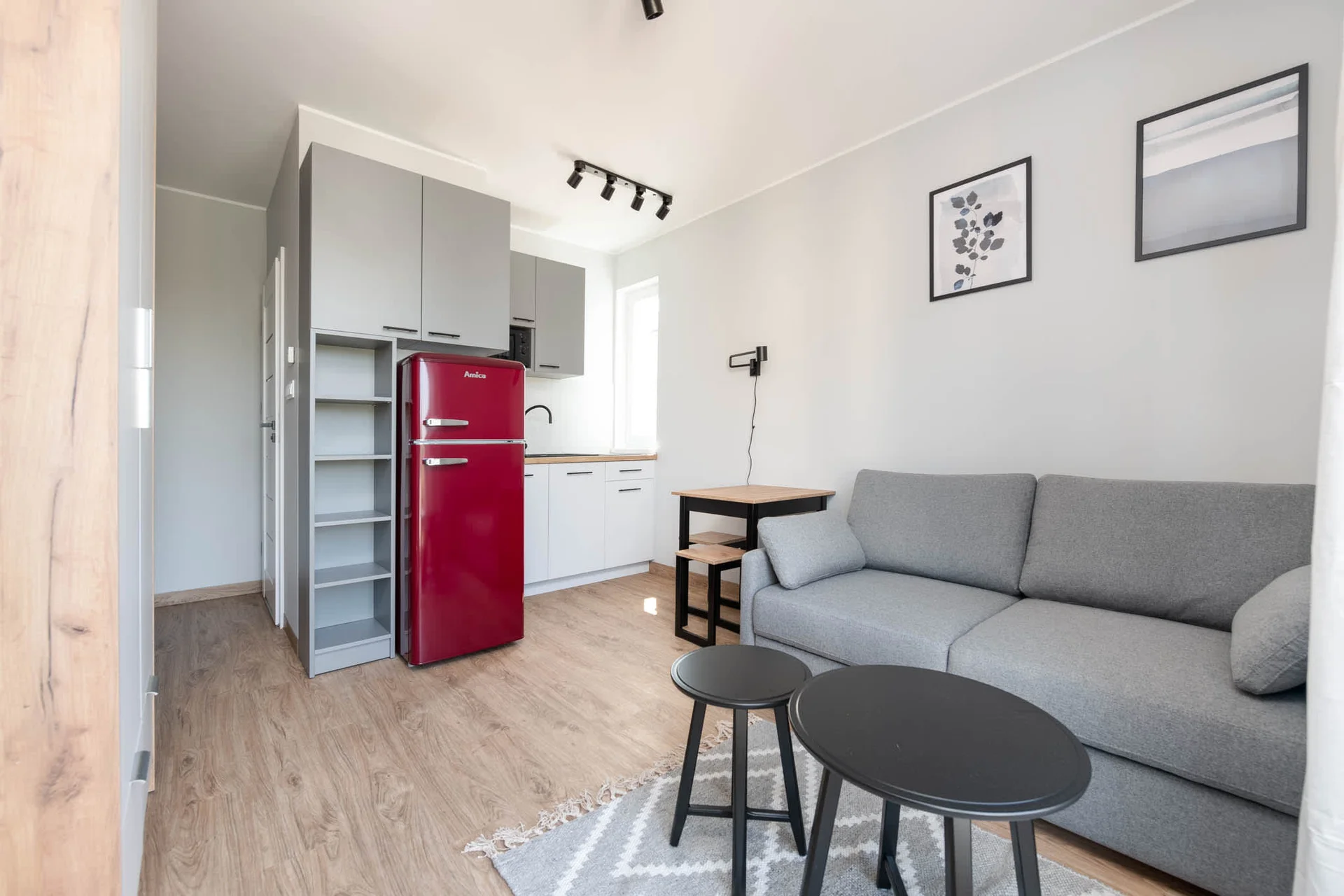 The elegant living area featuring a double sofa bed, perfect for relaxing or sleeping.