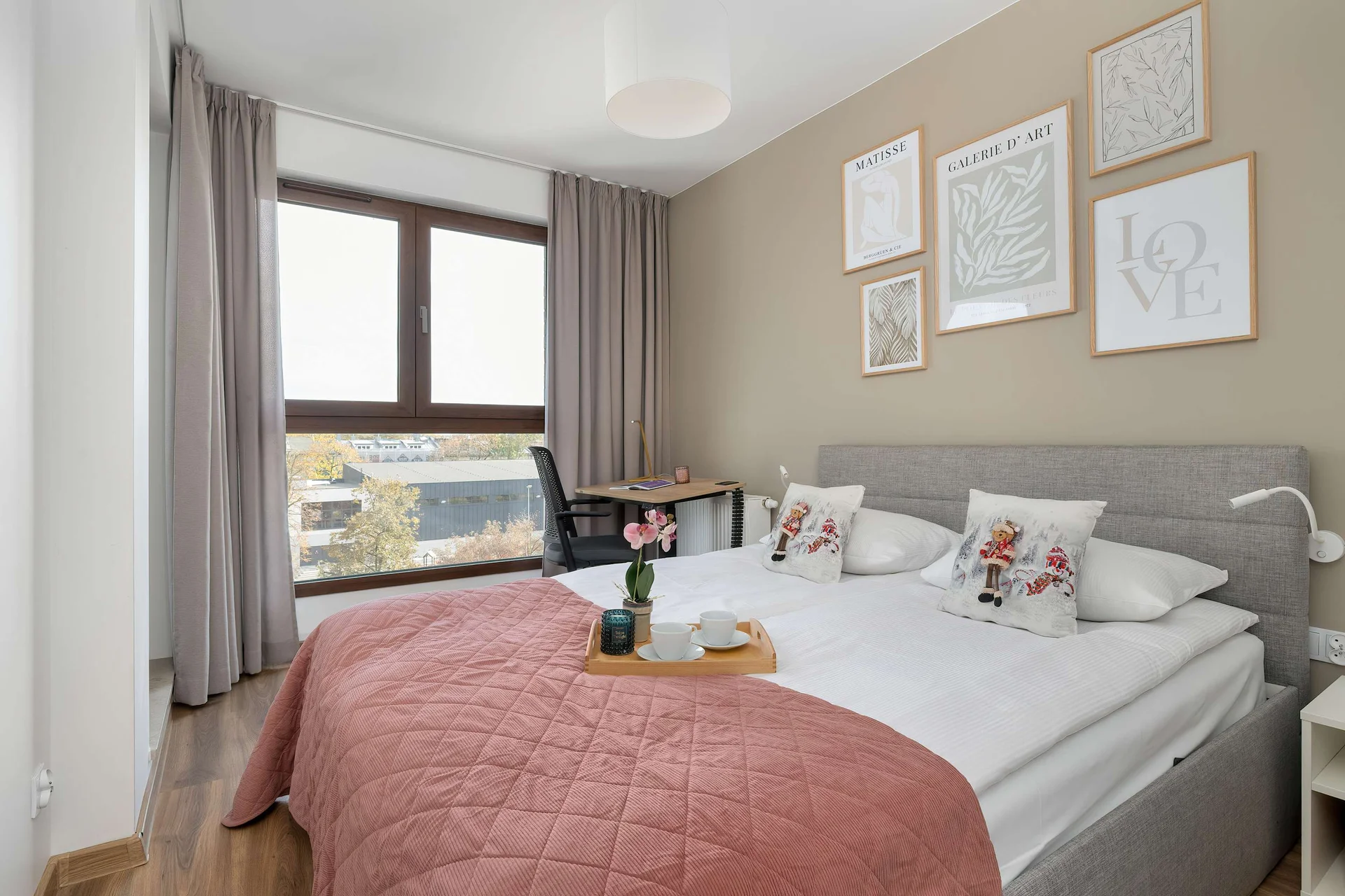 The cozy bedroom with soft bedding and pastel accents creates a serene space perfect for unwinding after a day full of experiences.