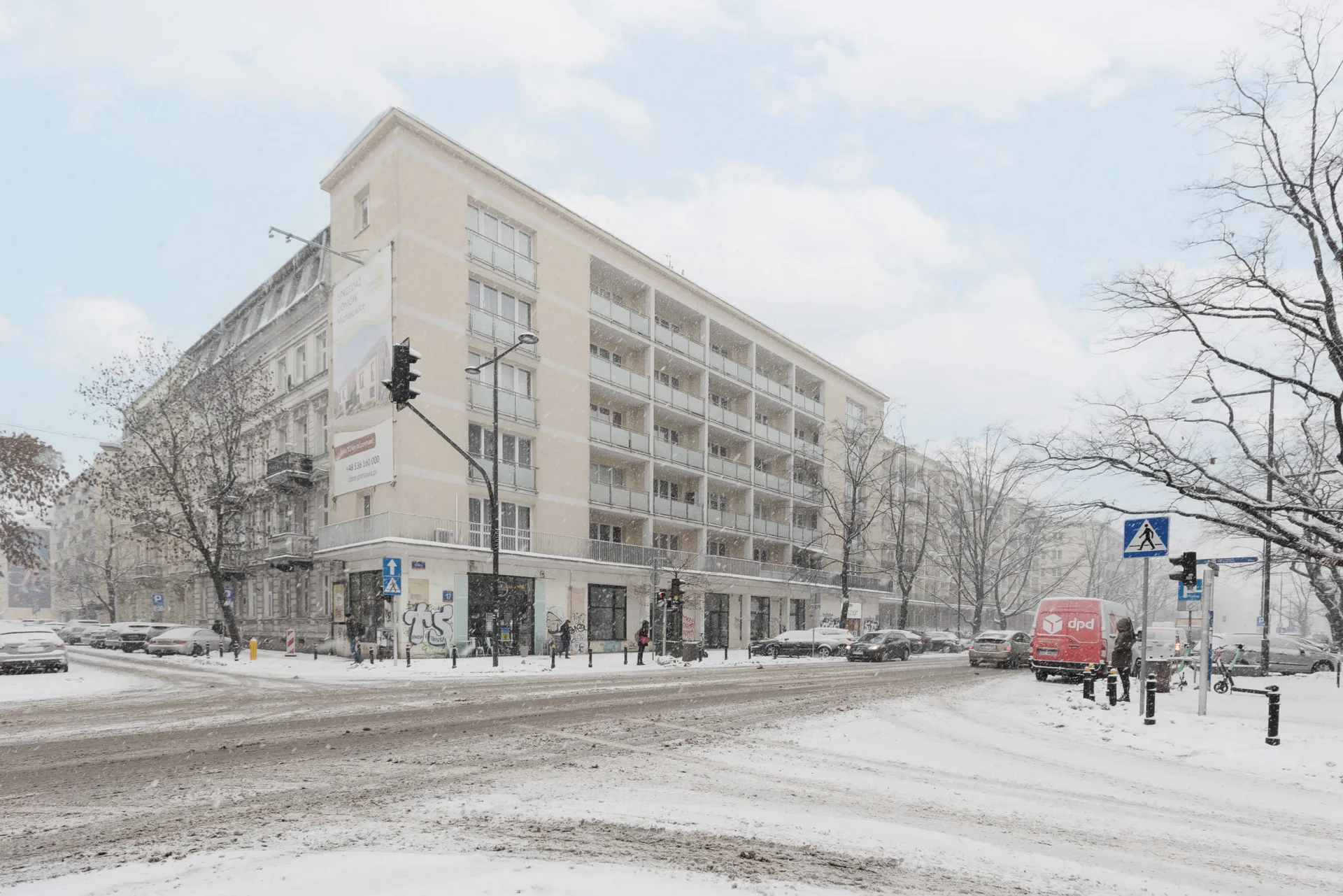 An exterior shot of a building during winter, with snow-covered surroundings.