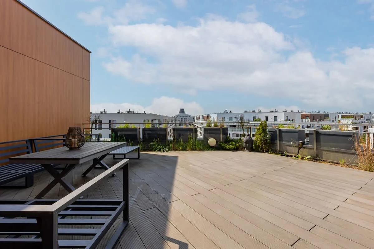 Spacious terrace with garden furniture.