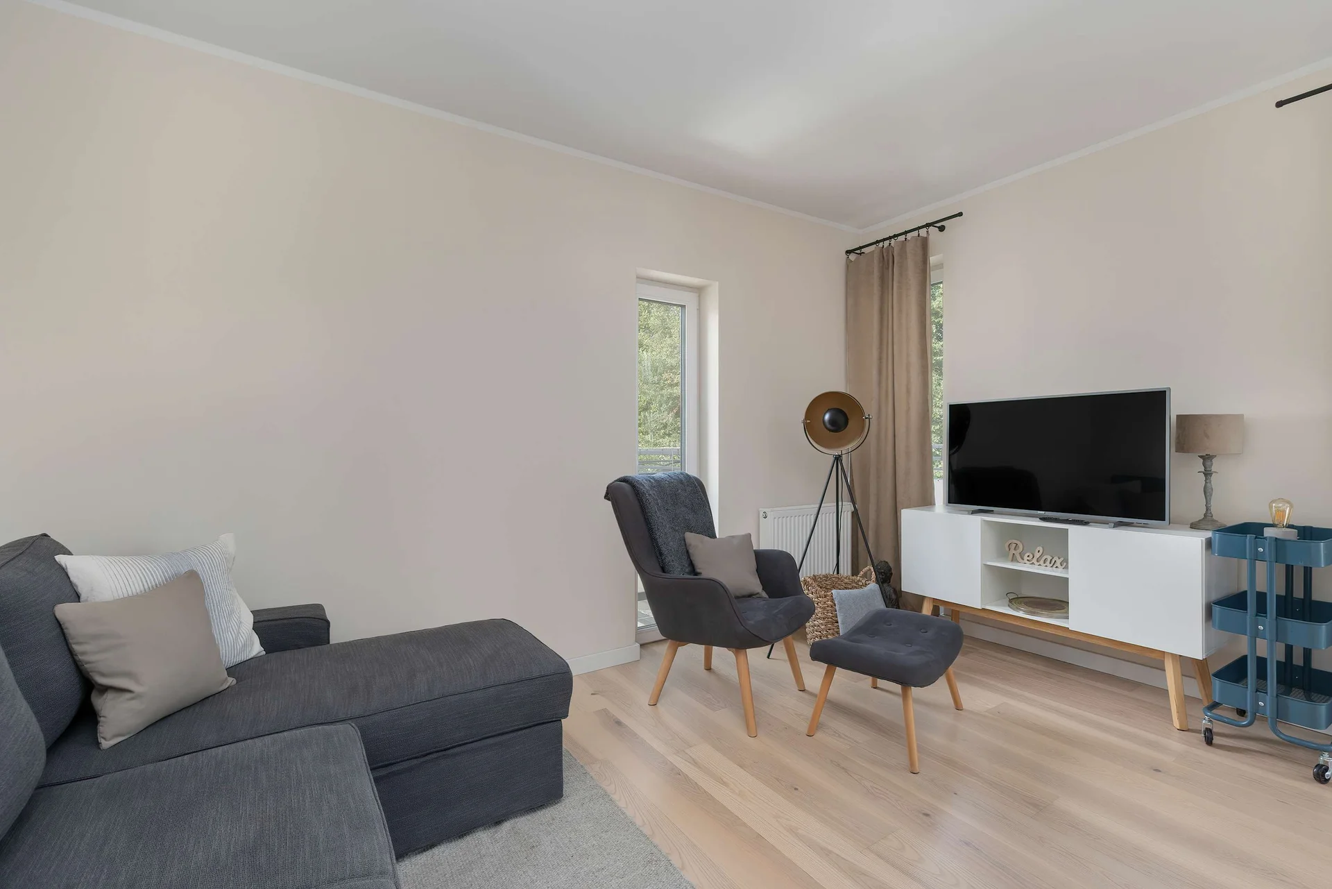 Spacious open-plan living room with plenty of natural light.