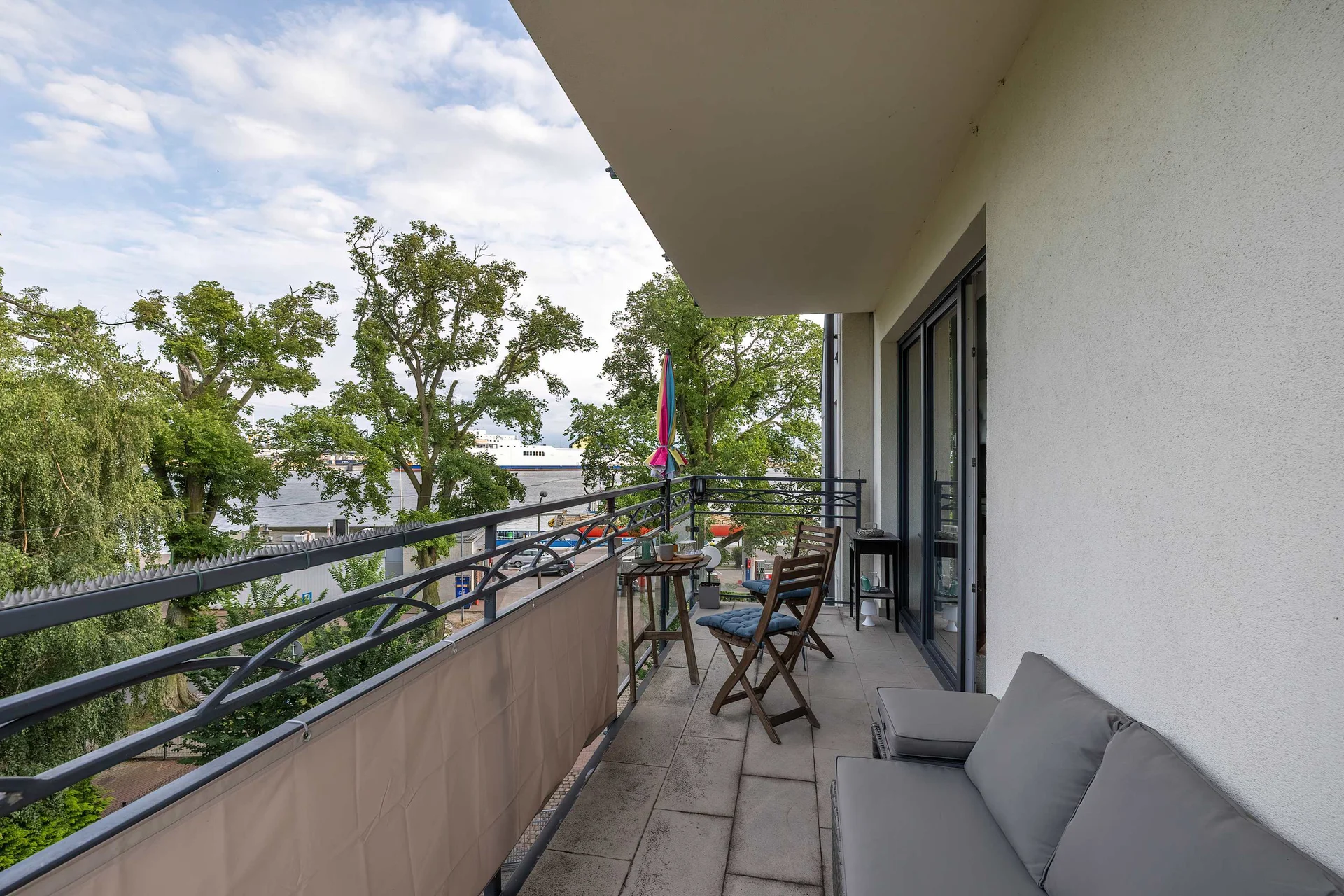 Cozy balcony with comfortable seating to relax outdoors.