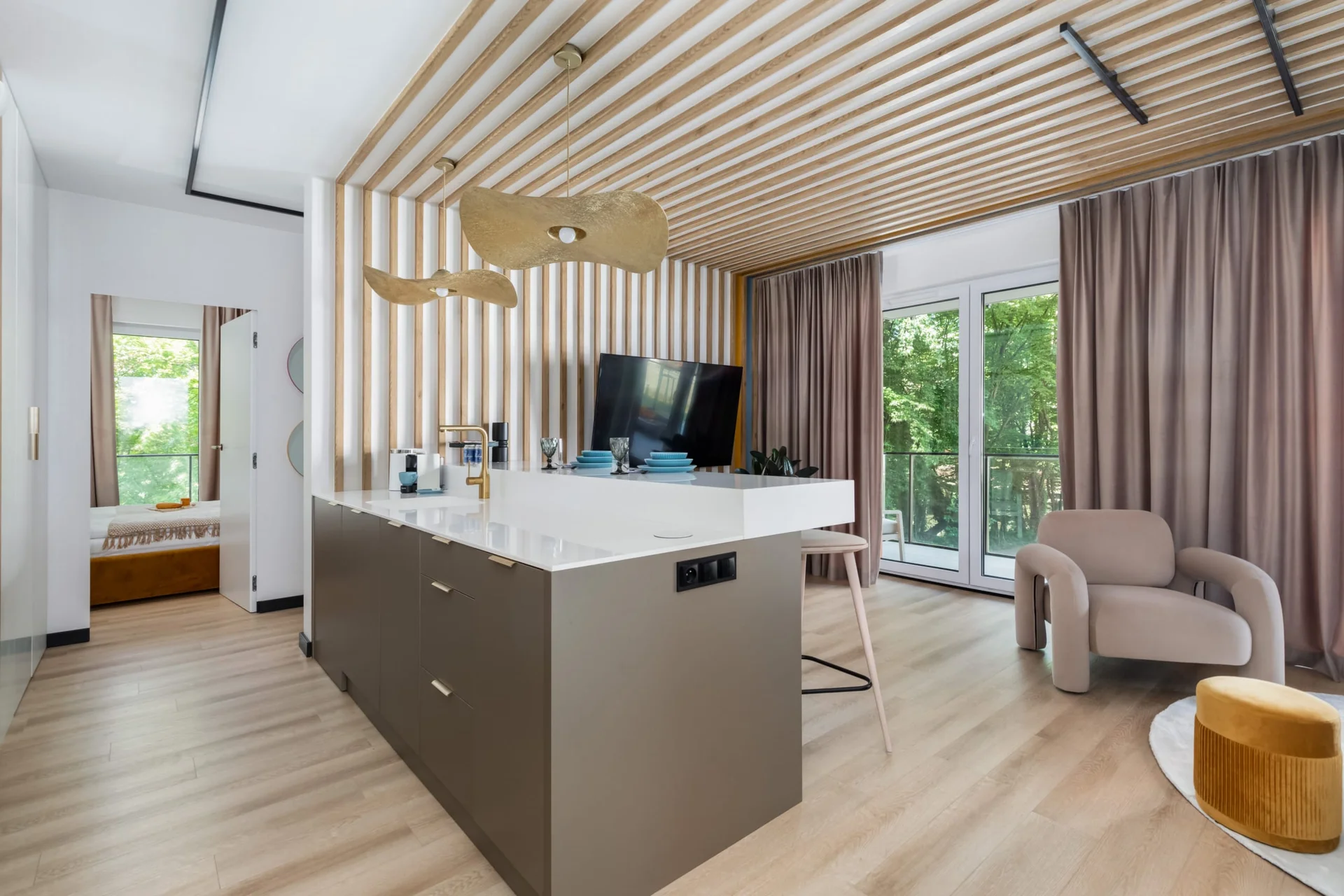 Open-plan kitchen and living area with sleek finishes and plenty of natural light.