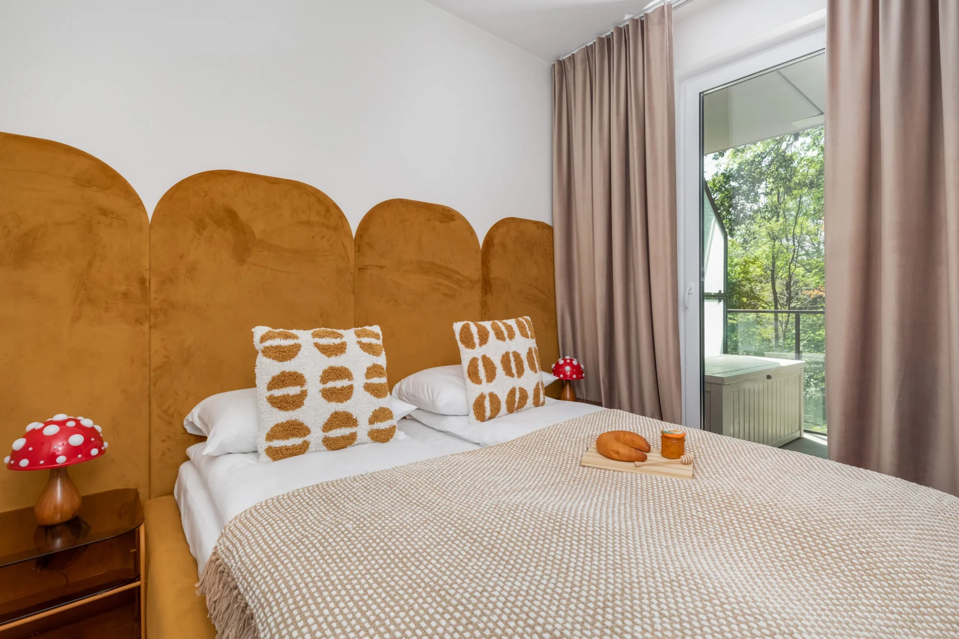 Cozy bedroom featuring a unique wooden headboard, crisp linens, and a tranquil ambiance.