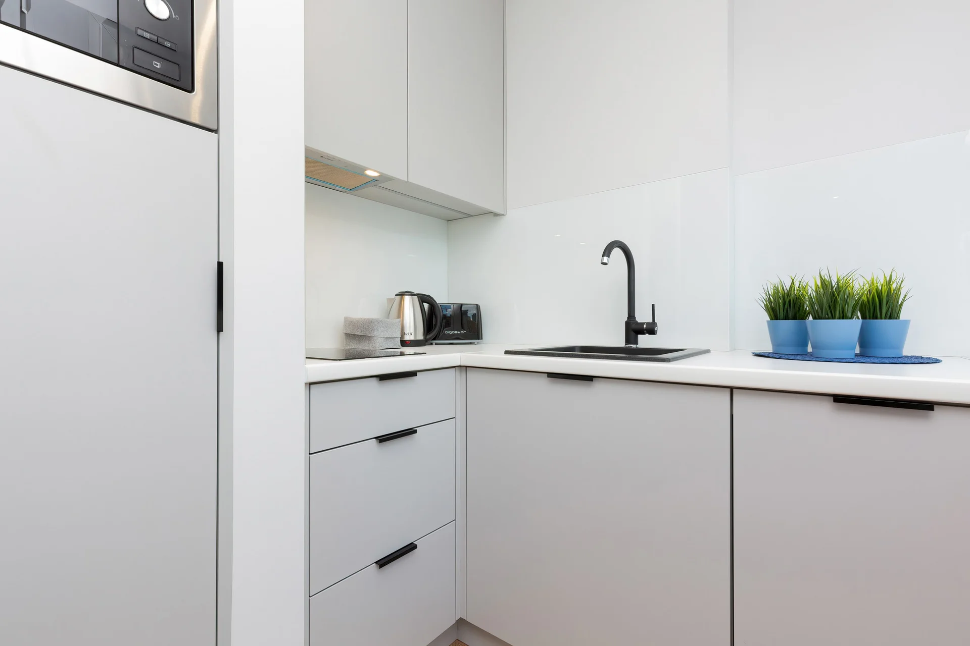 The fully equipped kitchenette includes everything you need for a home-cooked meal.