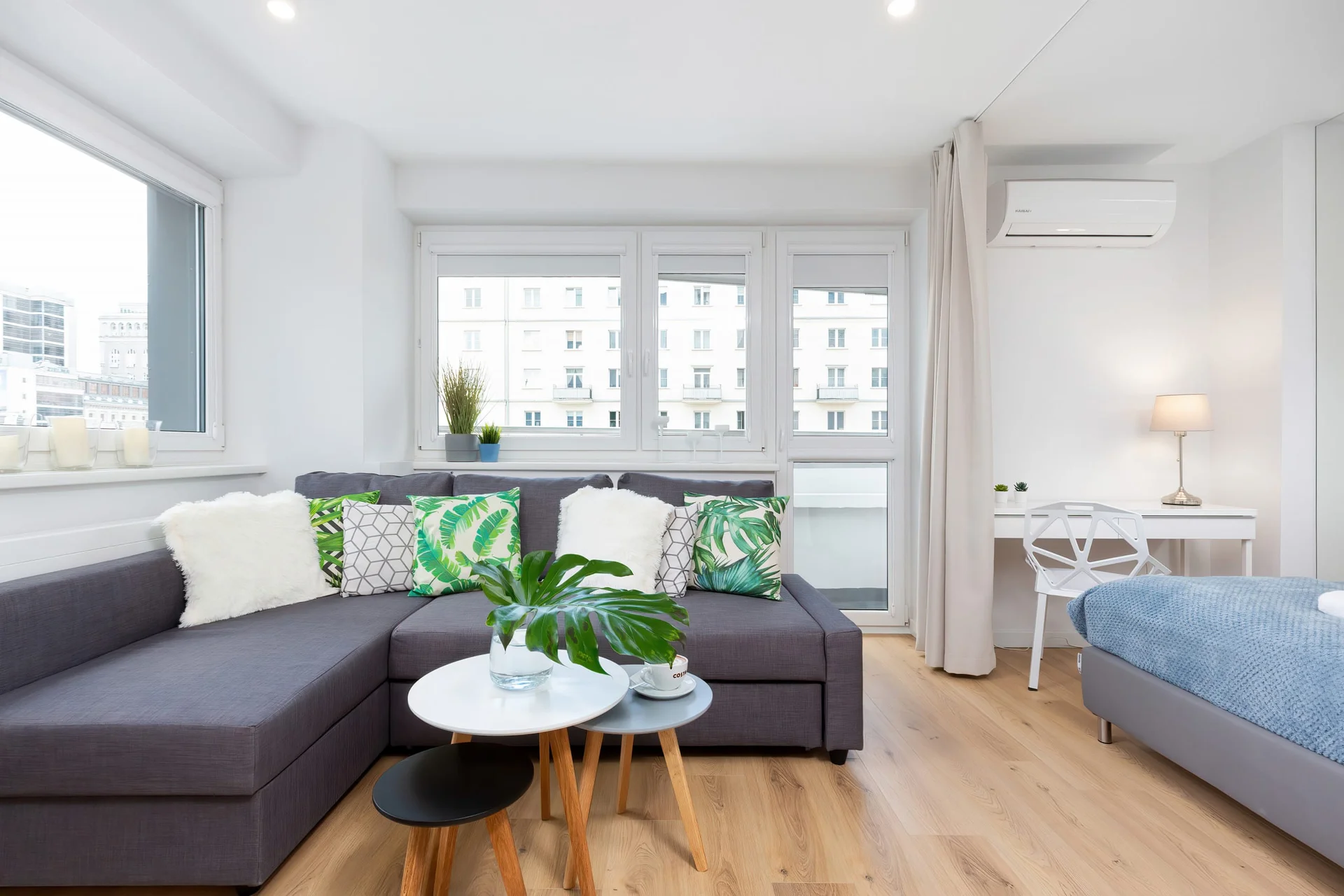 Relax in the stylish living area with a comfortable sofa and modern decor.