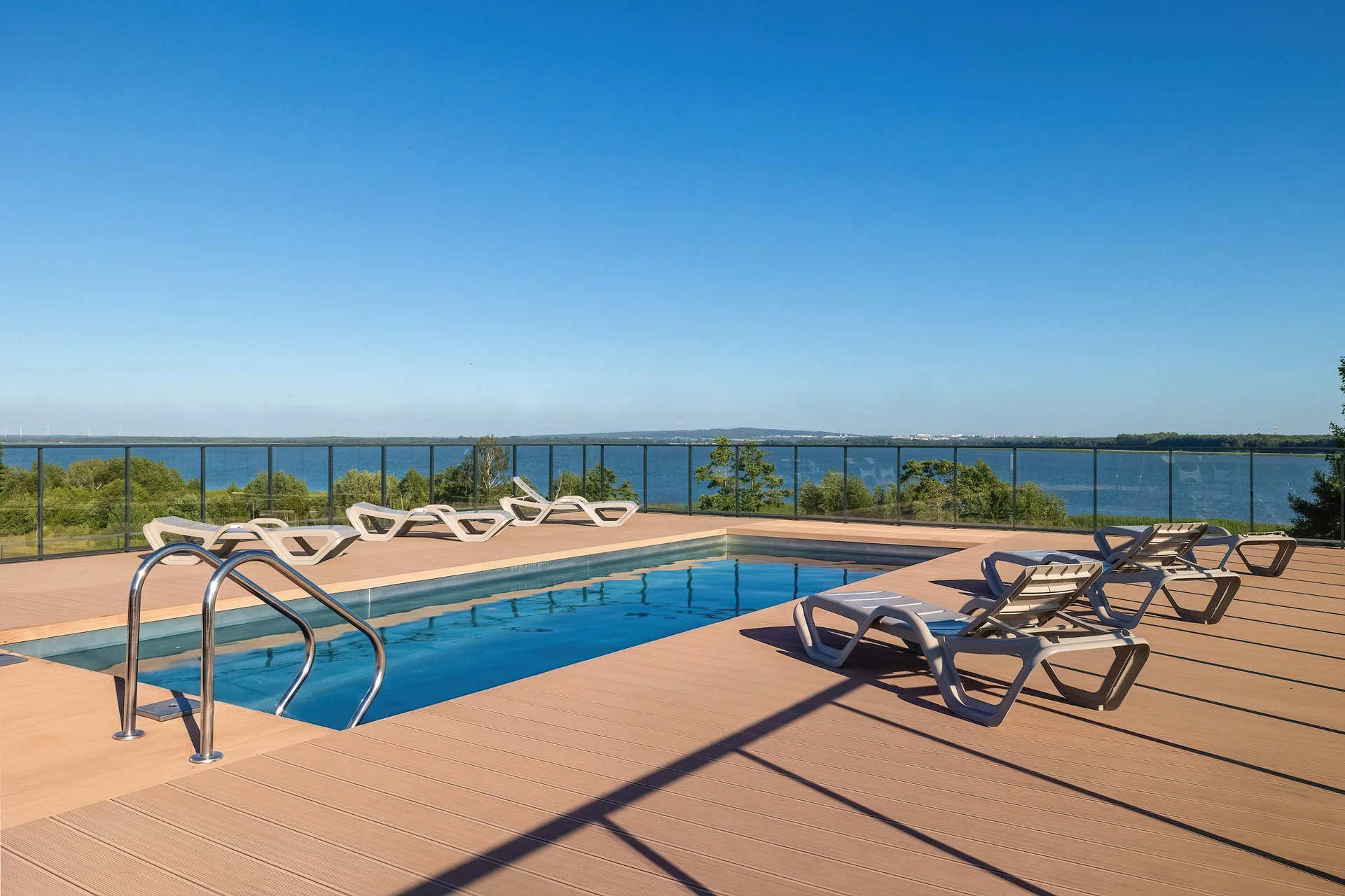 Rooftop terrace with comfortable lounge seating overlooking the city.