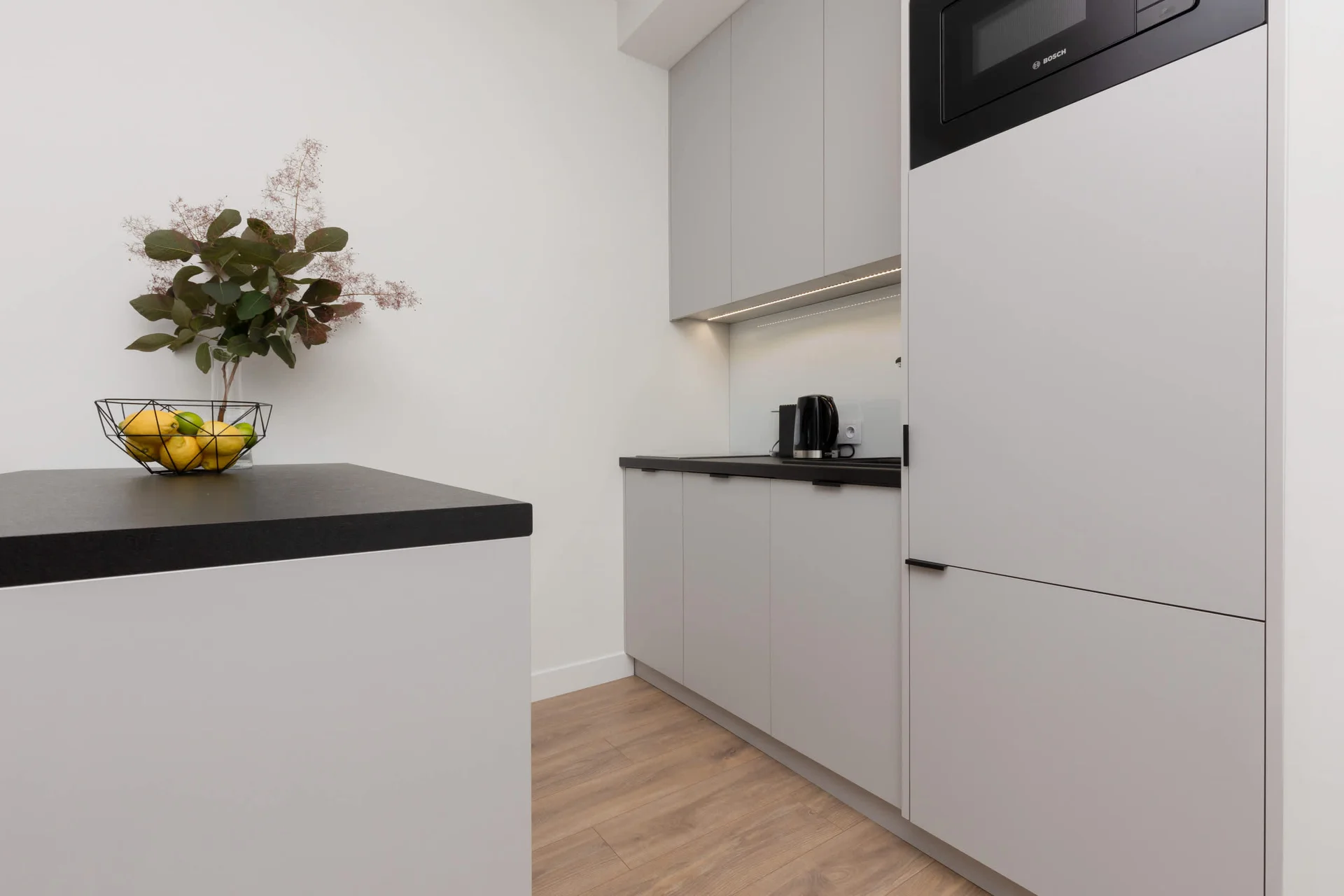 The kitchenette's practical layout maximizes space and functionality.